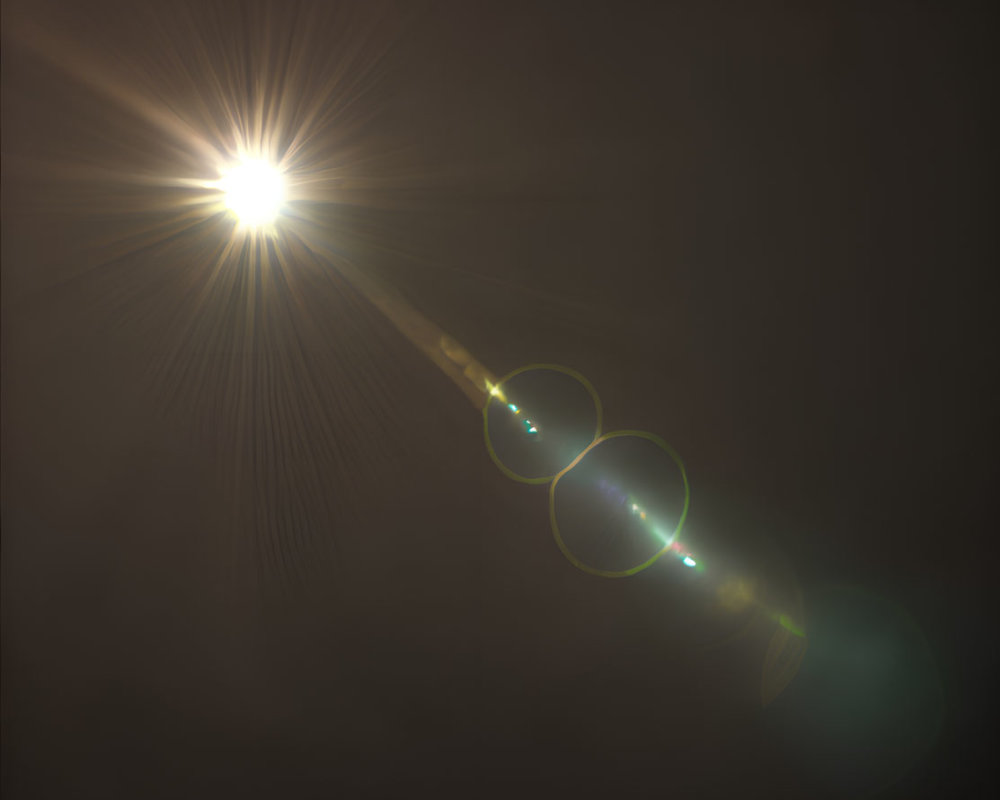 Bright Light Source with Radiating Rays and Lens Flare Effects