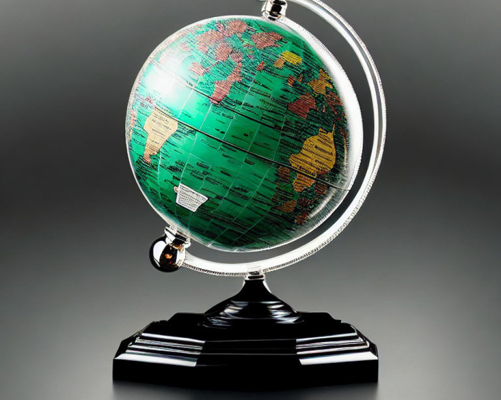 Detailed Green and Tan Terrestrial Globe on Metallic Stand, Grey Background