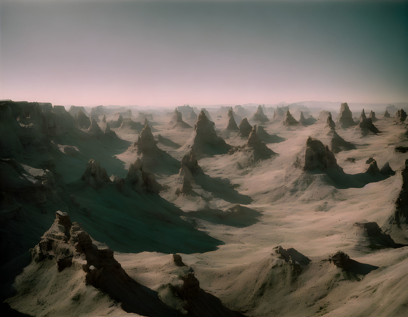 Rock formations in serene desert landscape at dusk