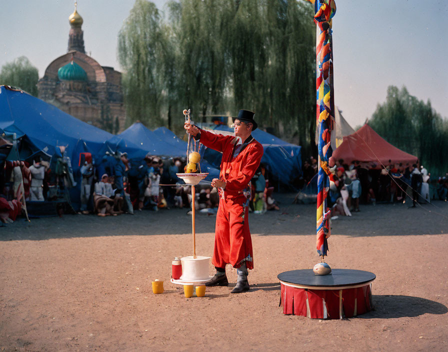 Performer Balances Spinning Plate at Fair