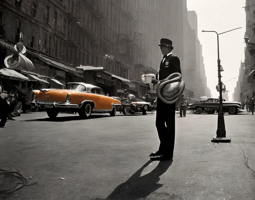 Vintage black-and-white photo of a colorized orange car with a policeman on a sunny street corner.