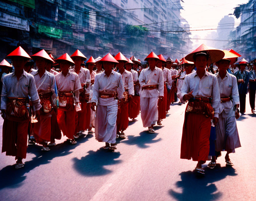 Traditional Asian Attire Group Marching Down Street