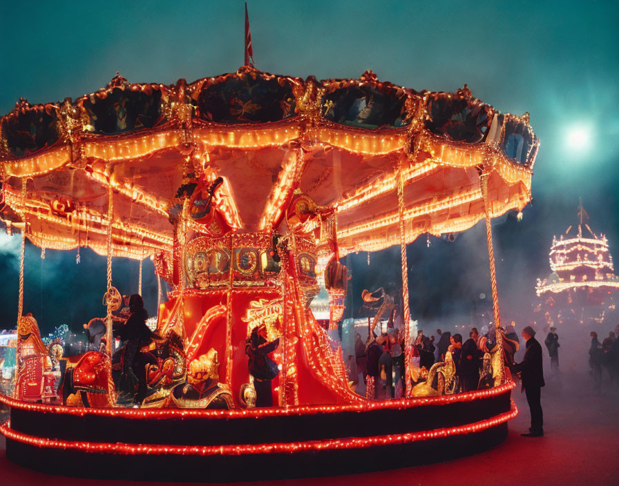 Nighttime merry-go-round with illuminated people and festive lights.