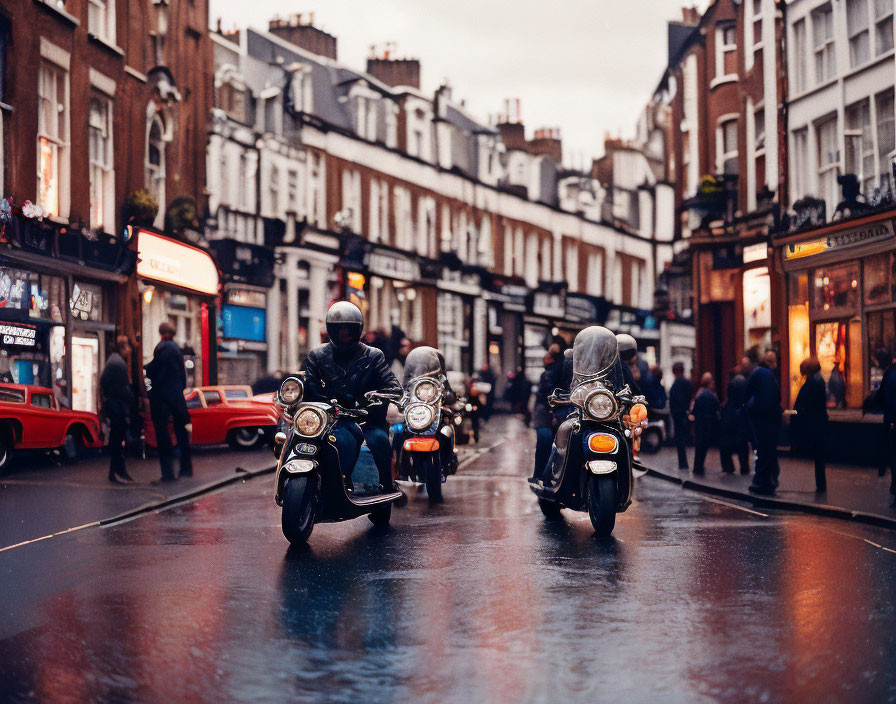 Two motorcyclists on wet city street with classic architecture and illuminated shops at dusk