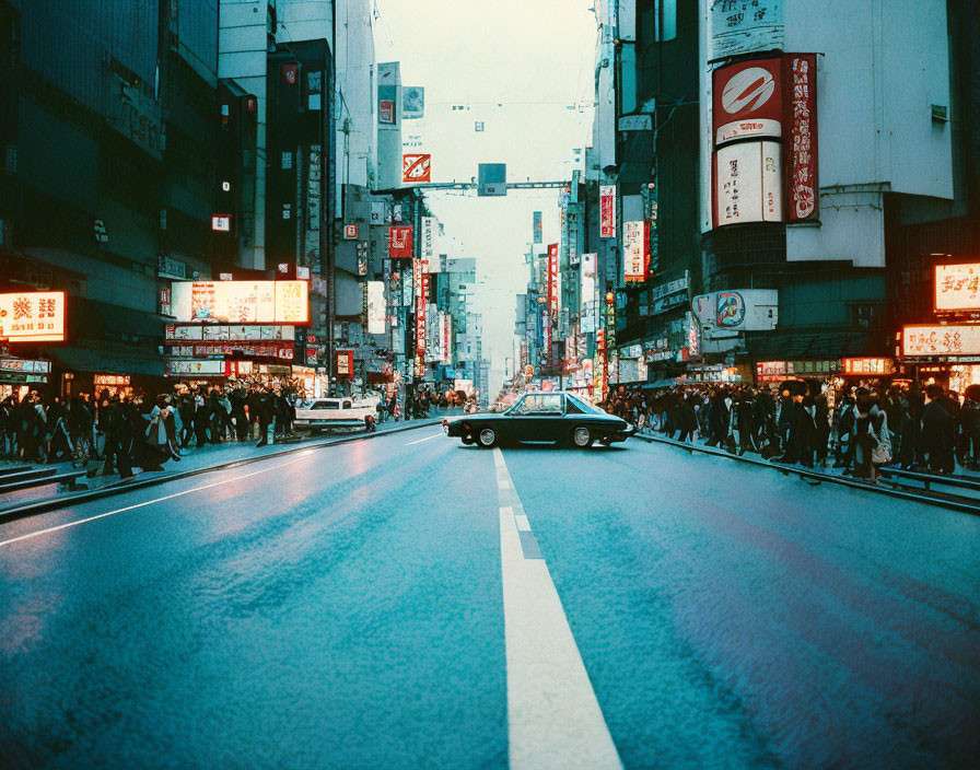 Vibrant twilight city street with neon signs, car, and pedestrians.