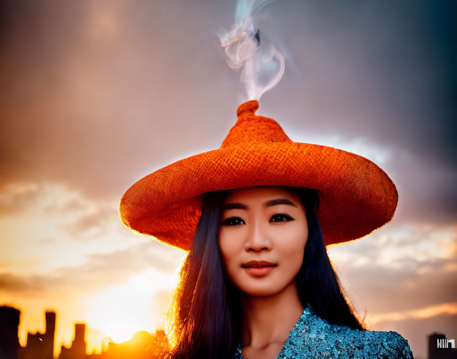 Woman in orange hat with smoking skyline backdrop