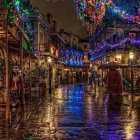 Medieval village cobblestone street at dusk with warm lights and church.