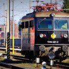 Steampunk train with ornate metalwork in retro-futuristic cityscape