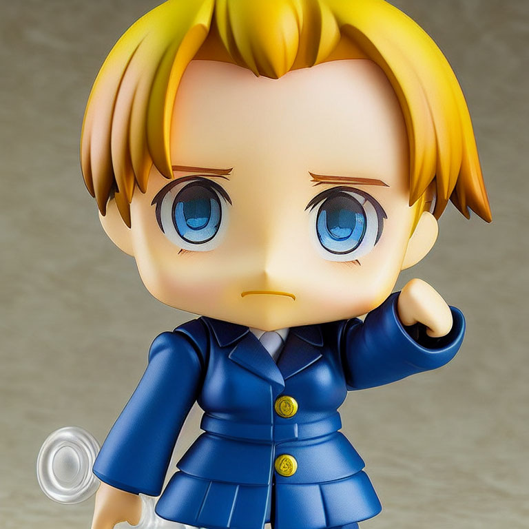 Blonde Hair Chibi Figure in Blue Suit with Pointing Gesture