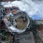 Surreal portrait of a woman in circular frame with mosaic and floral elements