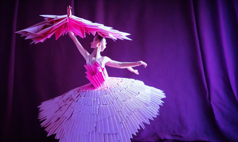 Graceful dancer in white and pink fan costume under purple lighting