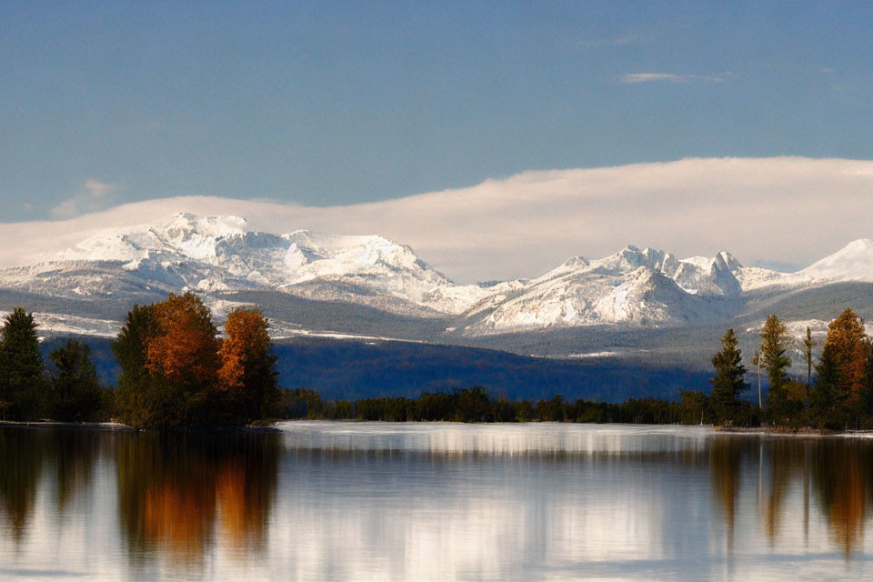 Scenic autumn lake with snow-capped mountains