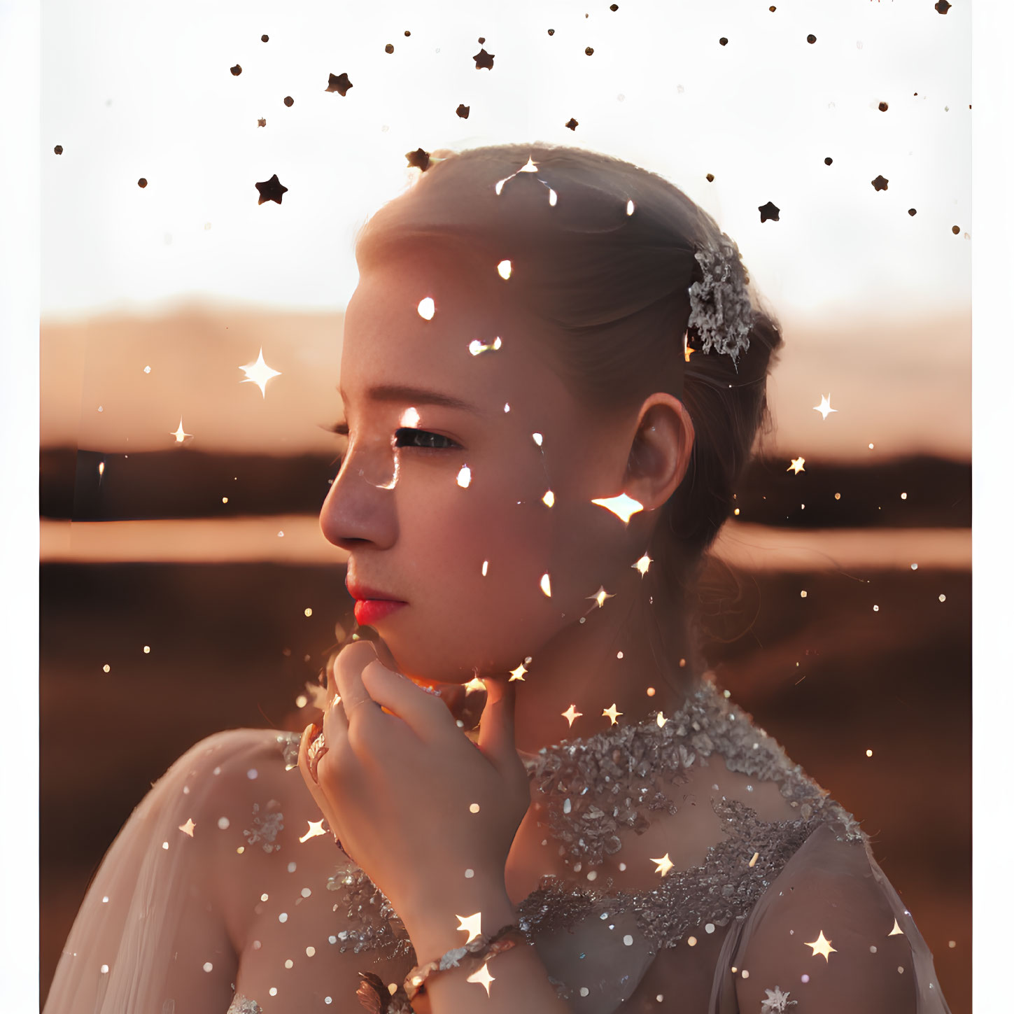 Thoughtful young woman with sparkling star effects on warm backdrop