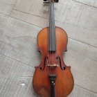 Violin resting on detailed sheet music showcasing classical beauty