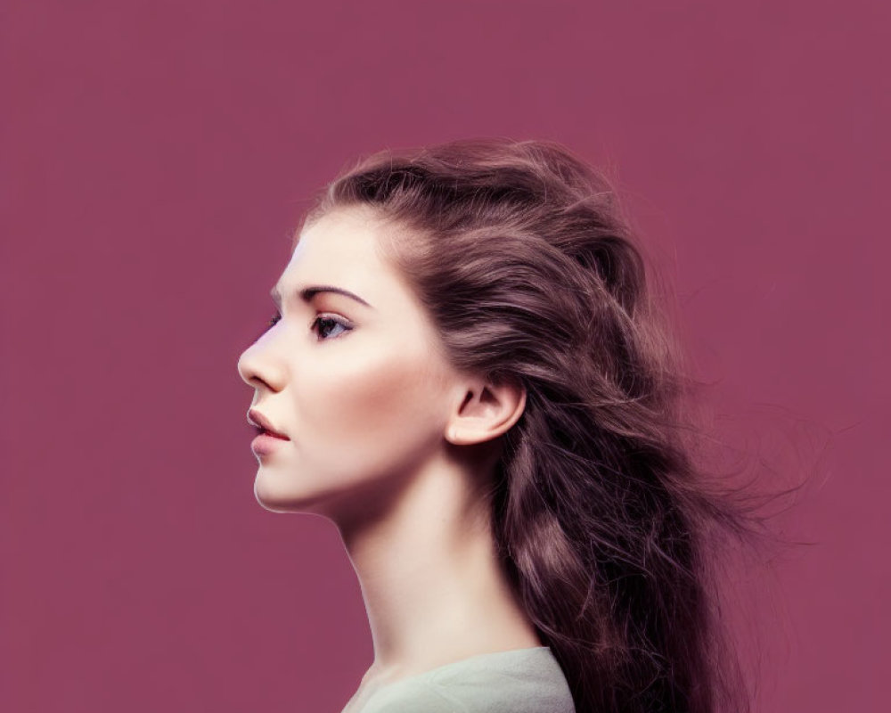 Young Woman with Voluminous Brunette Hair on Purple Background