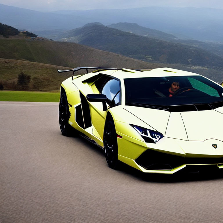 Yellow Lamborghini Aventador with driver on mountain road