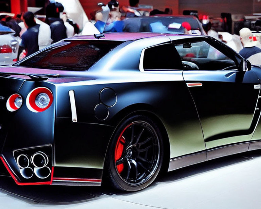 Black Sports Car with Unique Tail Lights and Large Exhausts at Auto Show