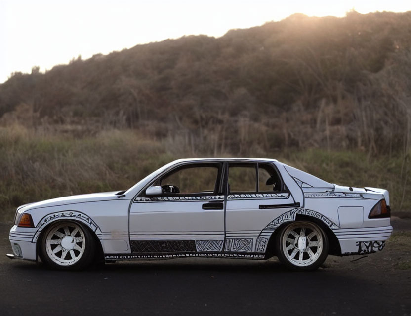 Custom Graphic White Sedan Parked Near Hillside at Twilight