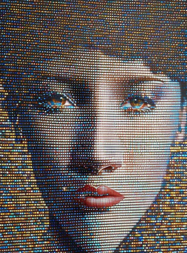 Detailed mosaic artwork featuring woman's face with bold lips and captivating eyes.