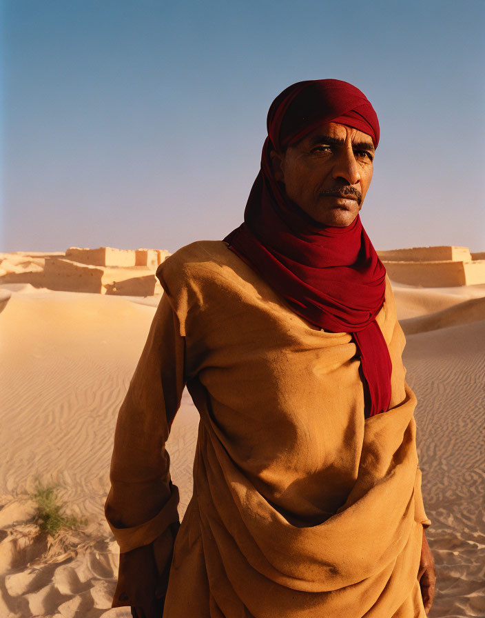 Traditional Attire Man Standing in Desert Landscape