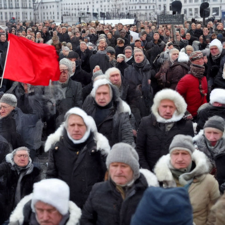 Crowd in Winter Clothing with Red Flag Outdoors