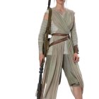 Futuristic woman in beige jumpsuit with rifle and short hair