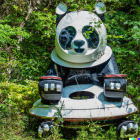 Digital Art: Panda-Shaped Robot in Lush Green Foliage