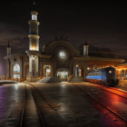 Vintage locomotive displayed at illuminated train station