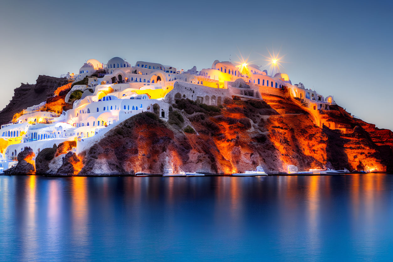 Whitewashed Buildings with Blue Domes Overlooking Calm Sea at Twilight