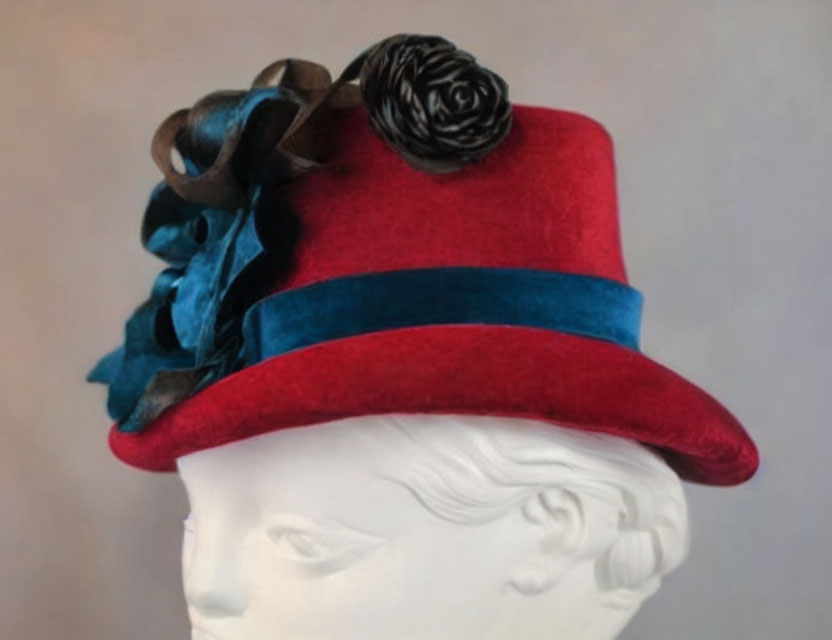 Red Hat with Blue Trim and Dark Rose on White Mannequin Head