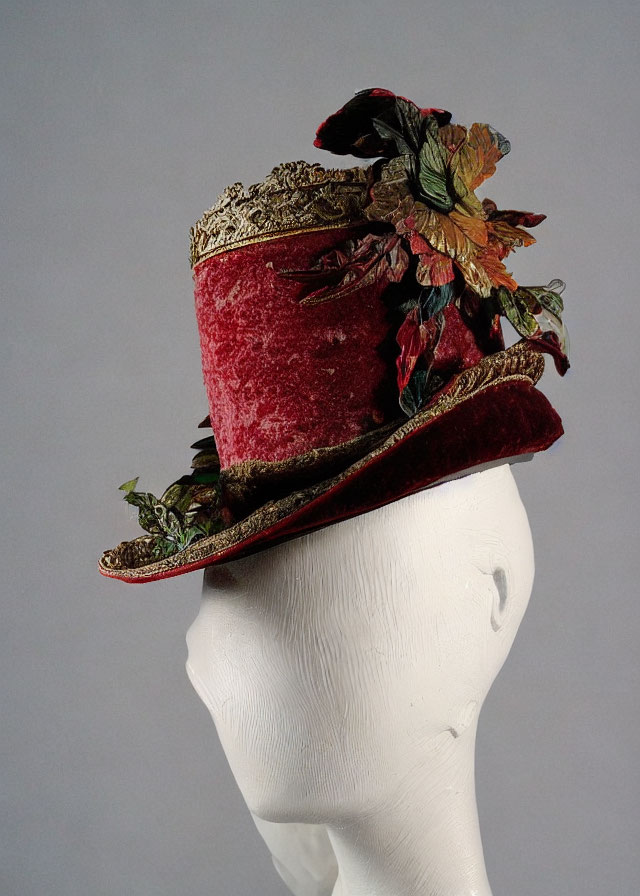 Red Vintage-Style Top Hat with Lace, Ribbon, Leaves, and Flowers on Mannequin