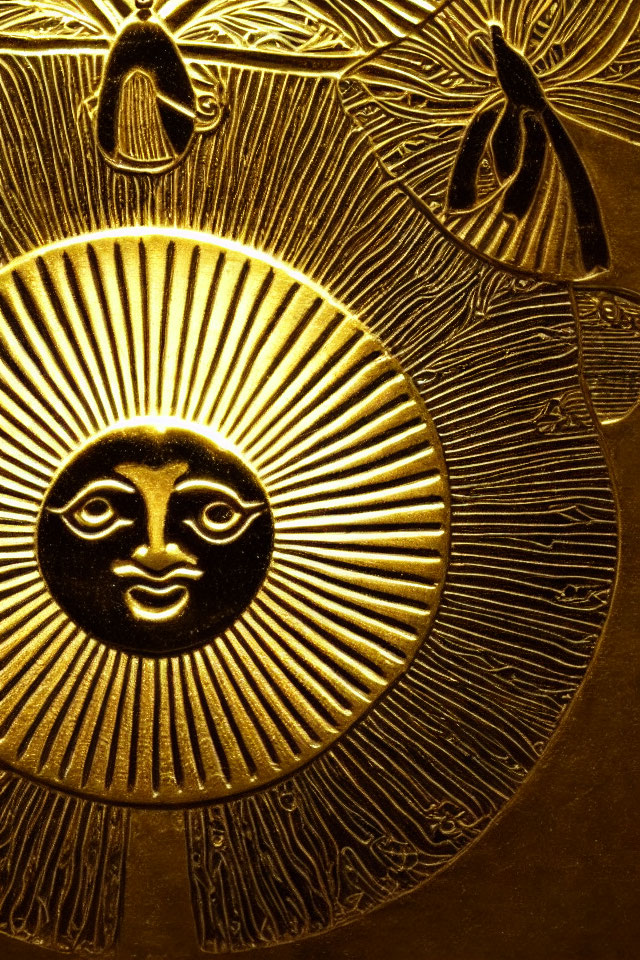 Intricate sun face design on golden textured surface