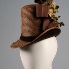 Red Vintage-Style Top Hat with Lace, Ribbon, Leaves, and Flowers on Mannequin