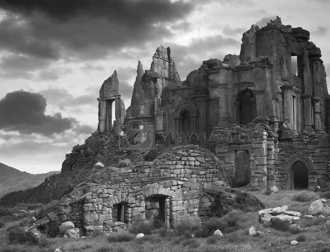 Monochrome image of weathered stone ruins in rugged landscape