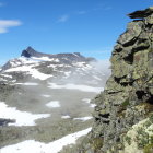 Panoramic Mountain Landscape with Jagged Peaks and Glacier Valley