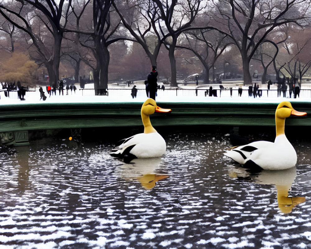 Large Duck Sculptures on Snow-Covered Water with People and Trees