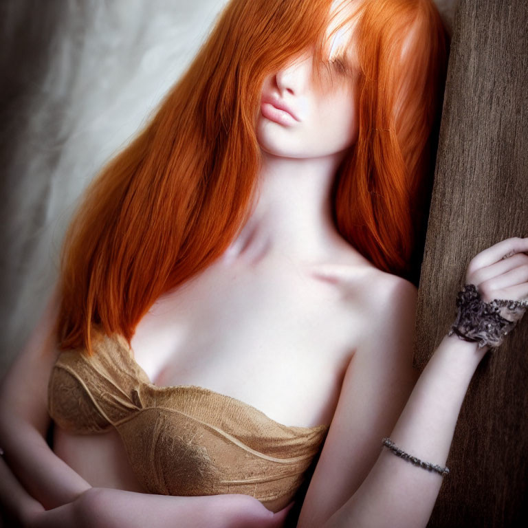 Red-haired woman in strapless top leaning on wooden surface