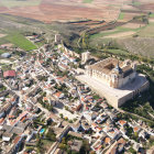 Stone buildings, grand churches, and bustling streets in an ancient hilltop city