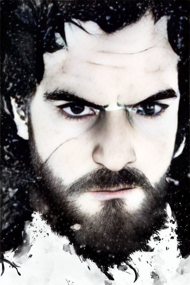 Intense-eyed bearded man with dark hair in snowy setting