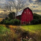 Red house with spire roof in serene autumn landscape, winding path, bare trees, colorful dusk sky