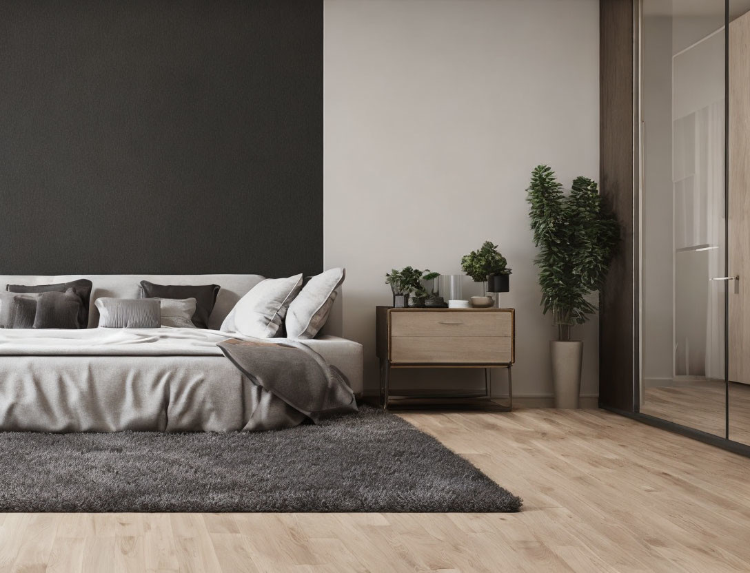 Neatly made bed with gray and white bedding, dark accent wall, wooden nightstand, plants