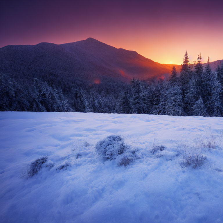 Snowy Dusk Landscape with Purple and Orange Skies over Mountain Silhouettes