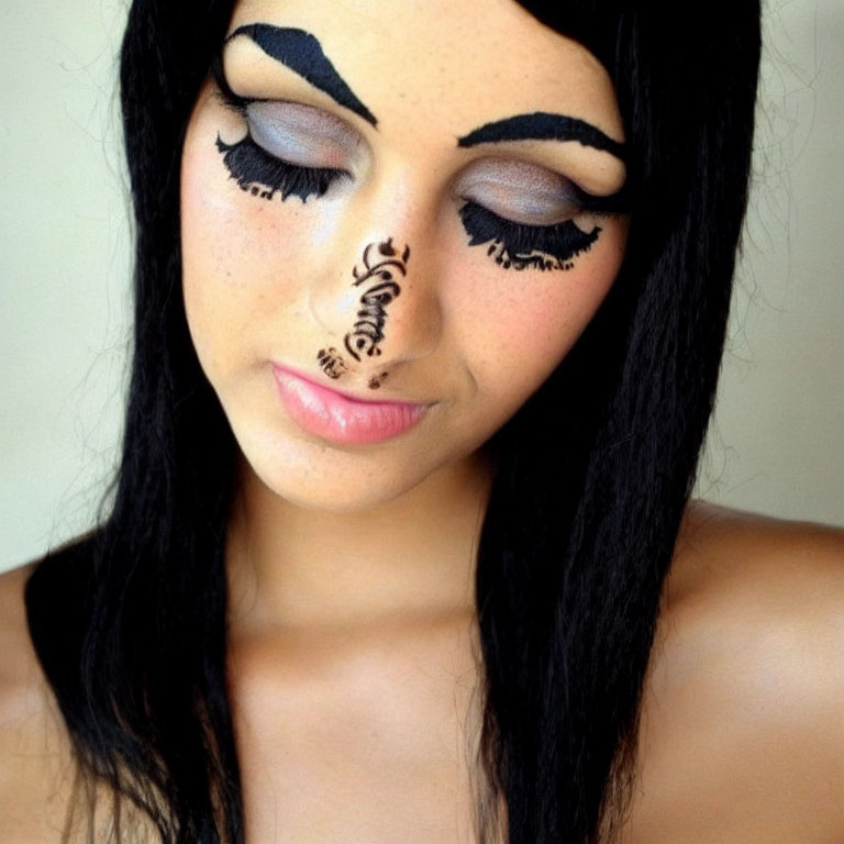 Elaborate artistic makeup with closed eyes and detailed design.