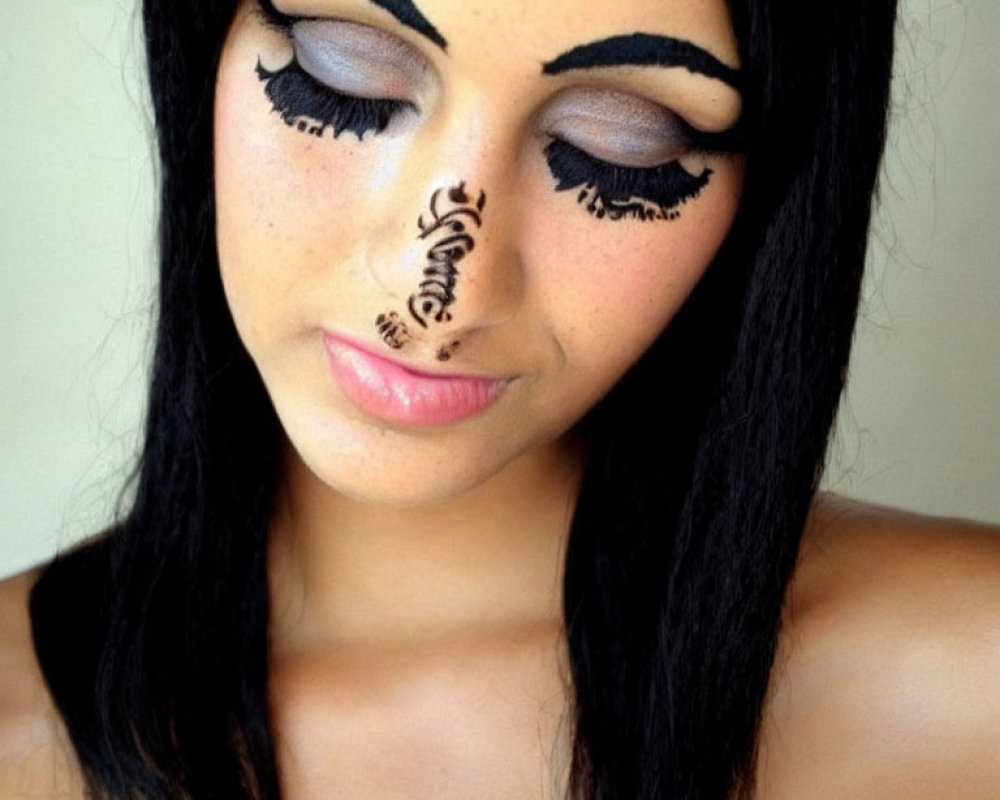 Elaborate artistic makeup with closed eyes and detailed design.