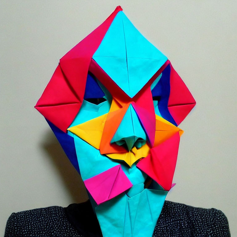 Colorful Geometric Origami Mask in Blues, Pinks, and Yellow on Neutral Background