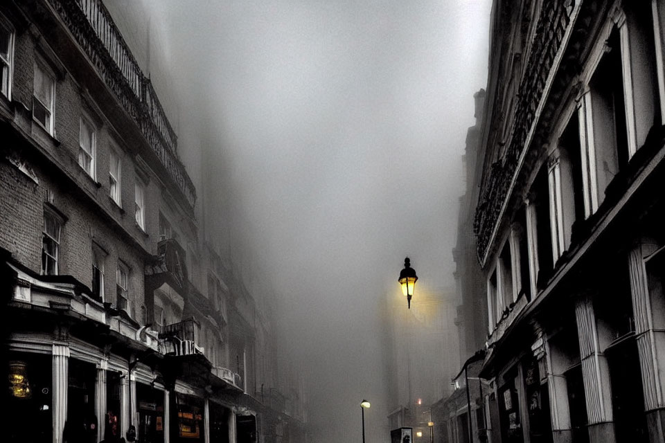 Foggy urban street with classic architecture and street lamps