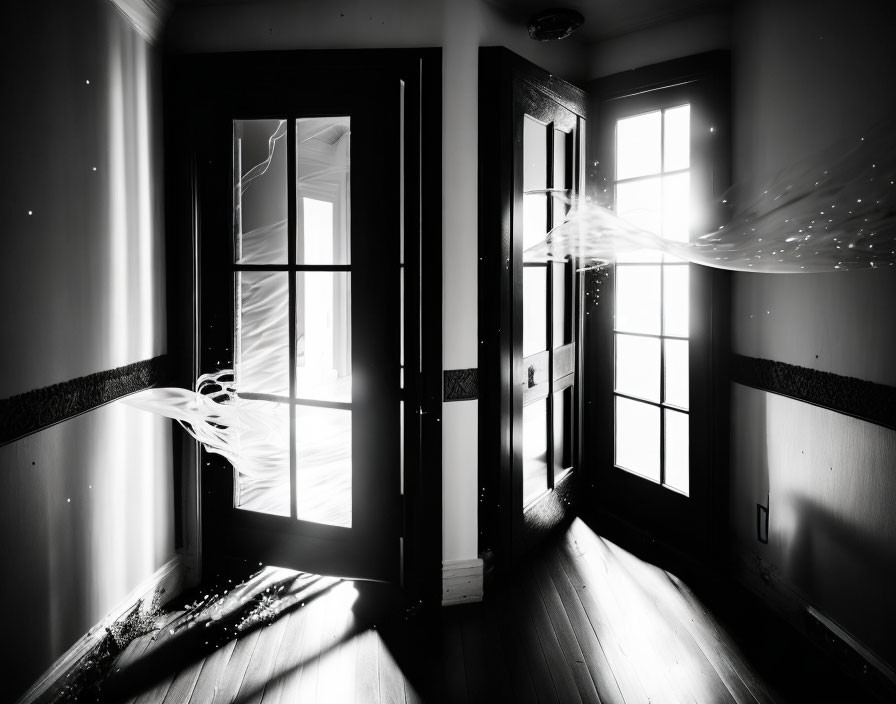 Surreal monochrome image with light streams entering dark room