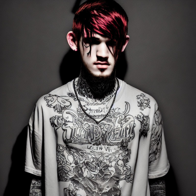 Pink-haired person with tattoos casting shadow on gray background