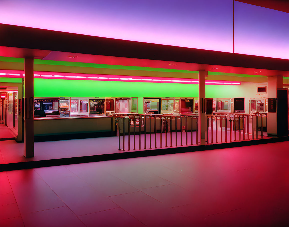 Cinema lobby with vibrant neon lights and ticket counters