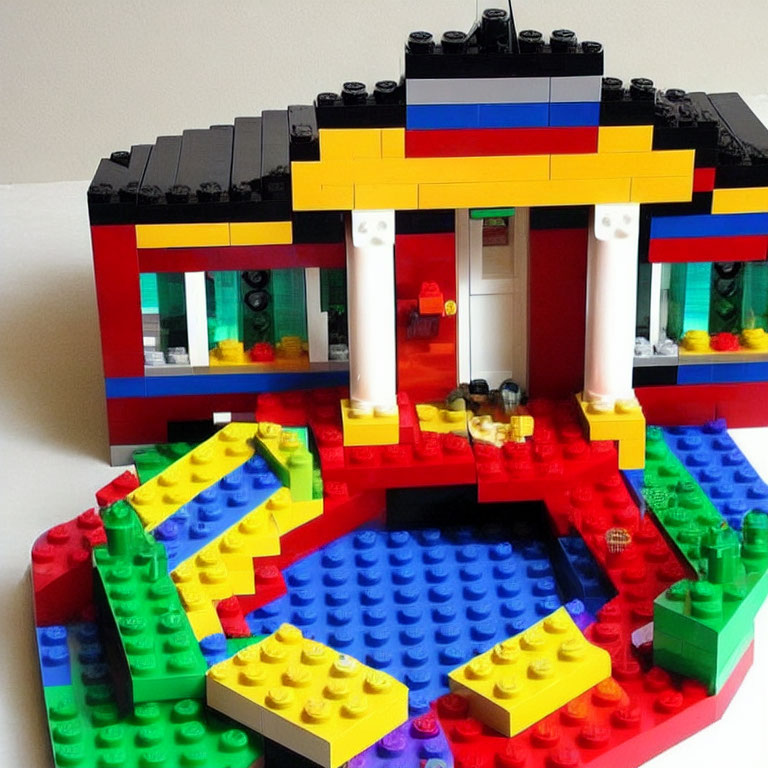 Vibrant Lego building with red, blue, and black exterior & colorful interior